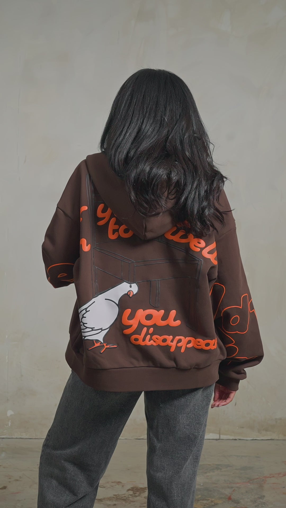 Brown Dove Zip-Up Hoodie — studio fit video, back print, female model