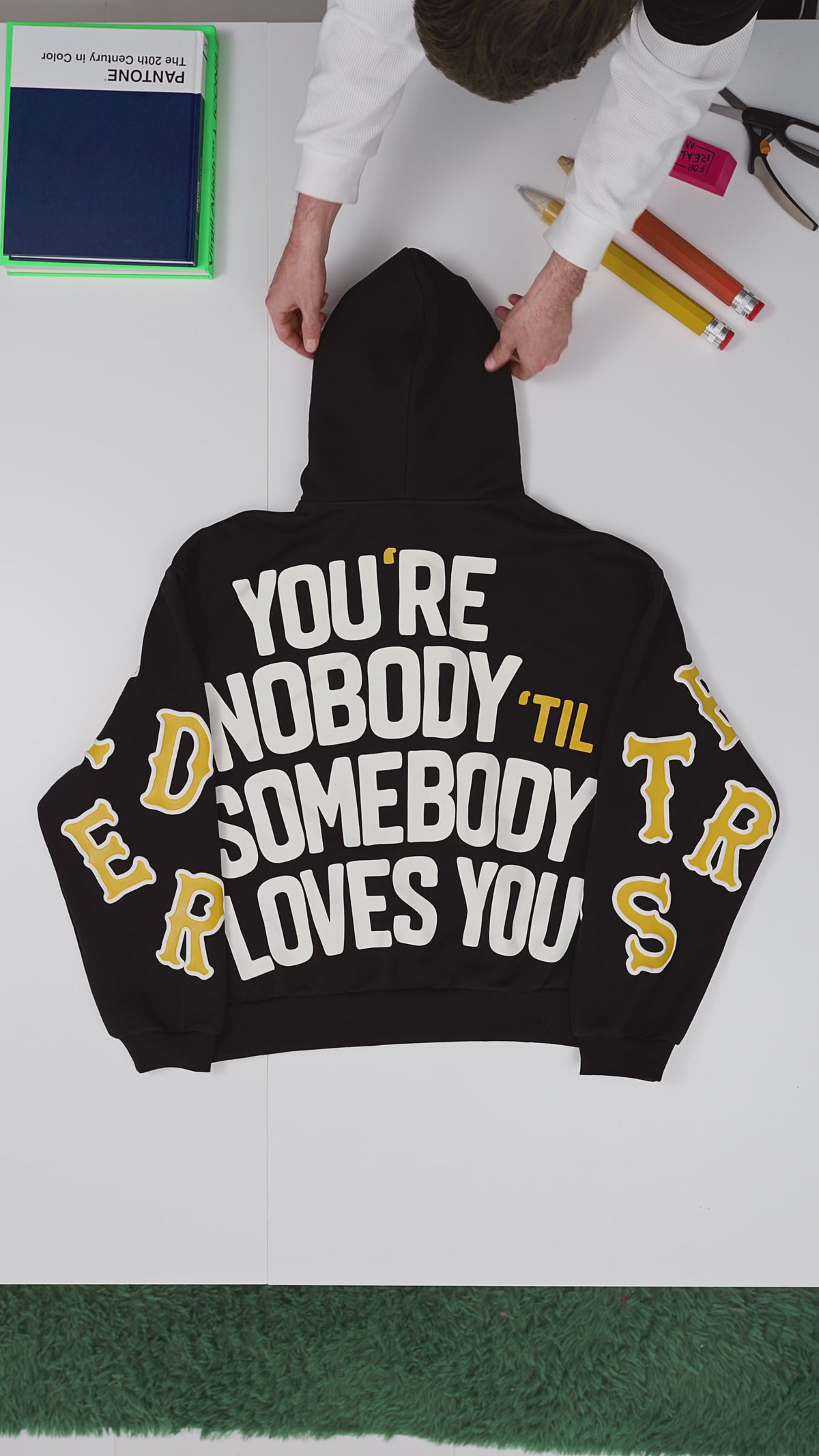 Black Somebody Hoodie — flat-lay video, back print