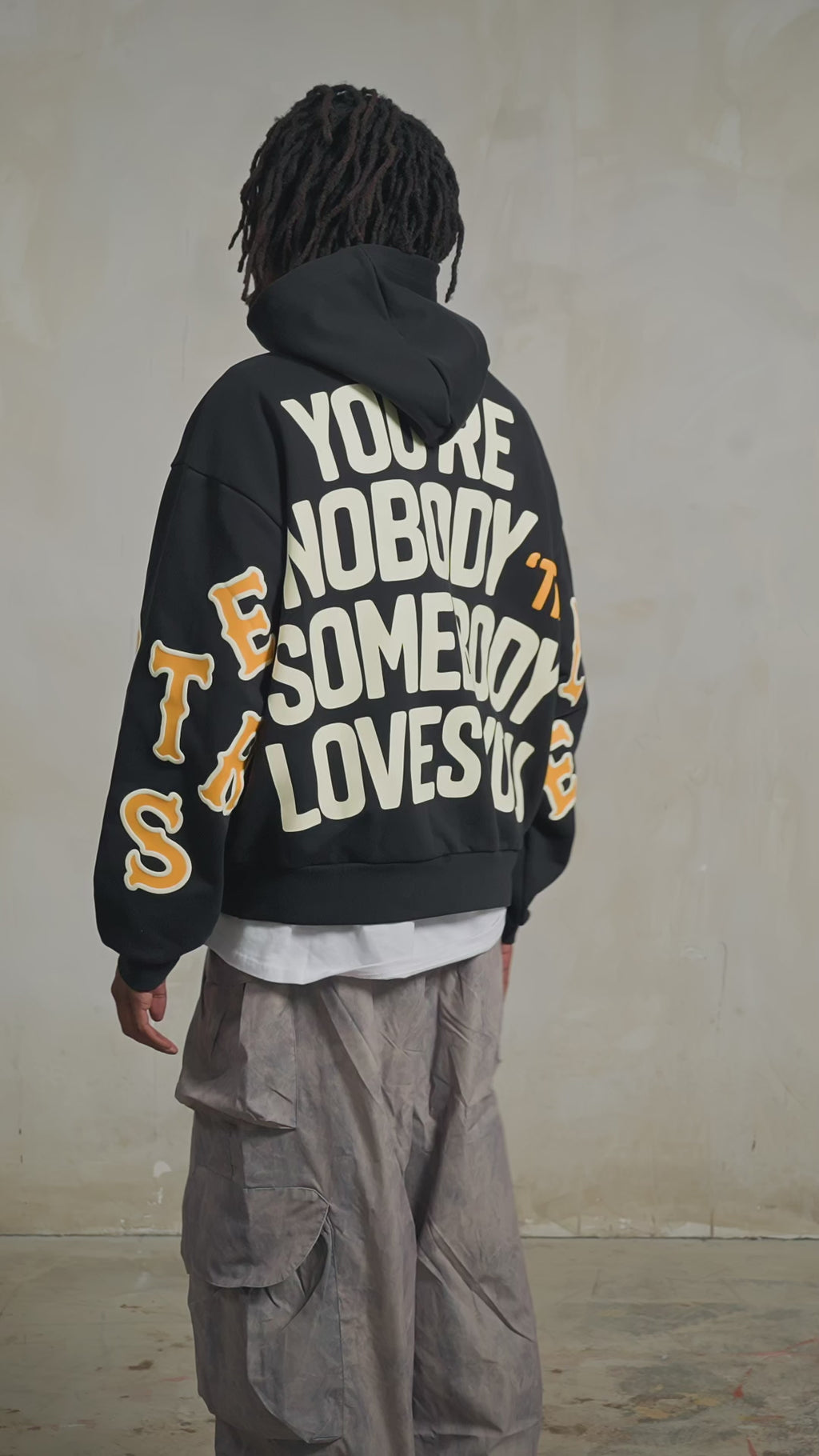 Black Somebody Hoodie — studio fit video, back print
