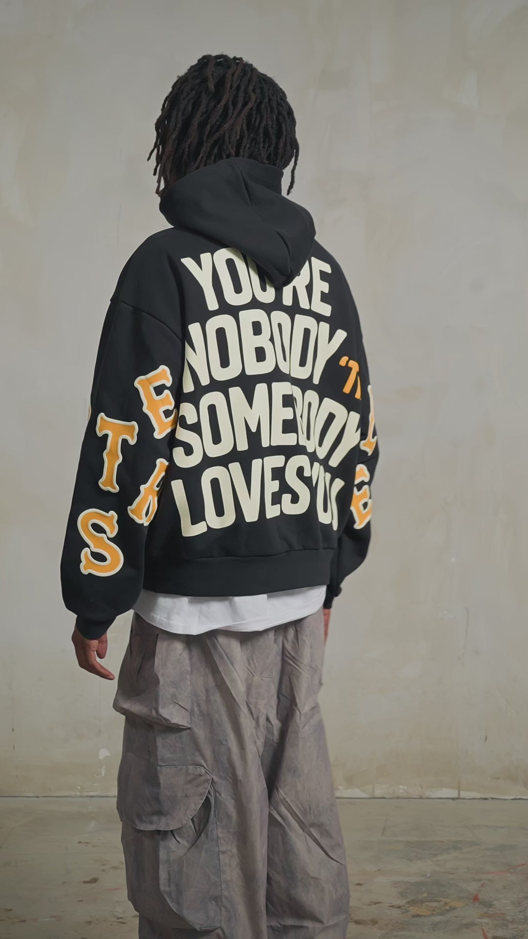 Black Somebody Hoodie — studio fit video, back print