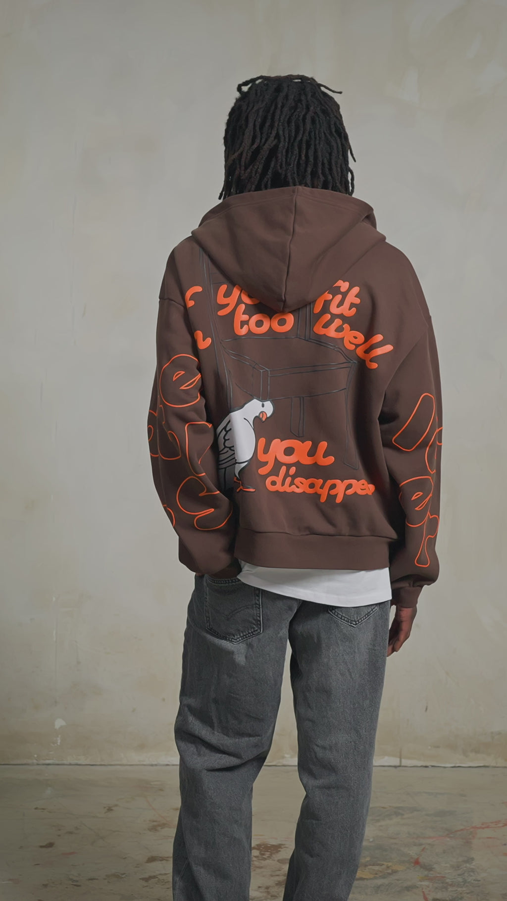 Brown Dove Zip-Up Hoodie — studio fit video, back print, male model