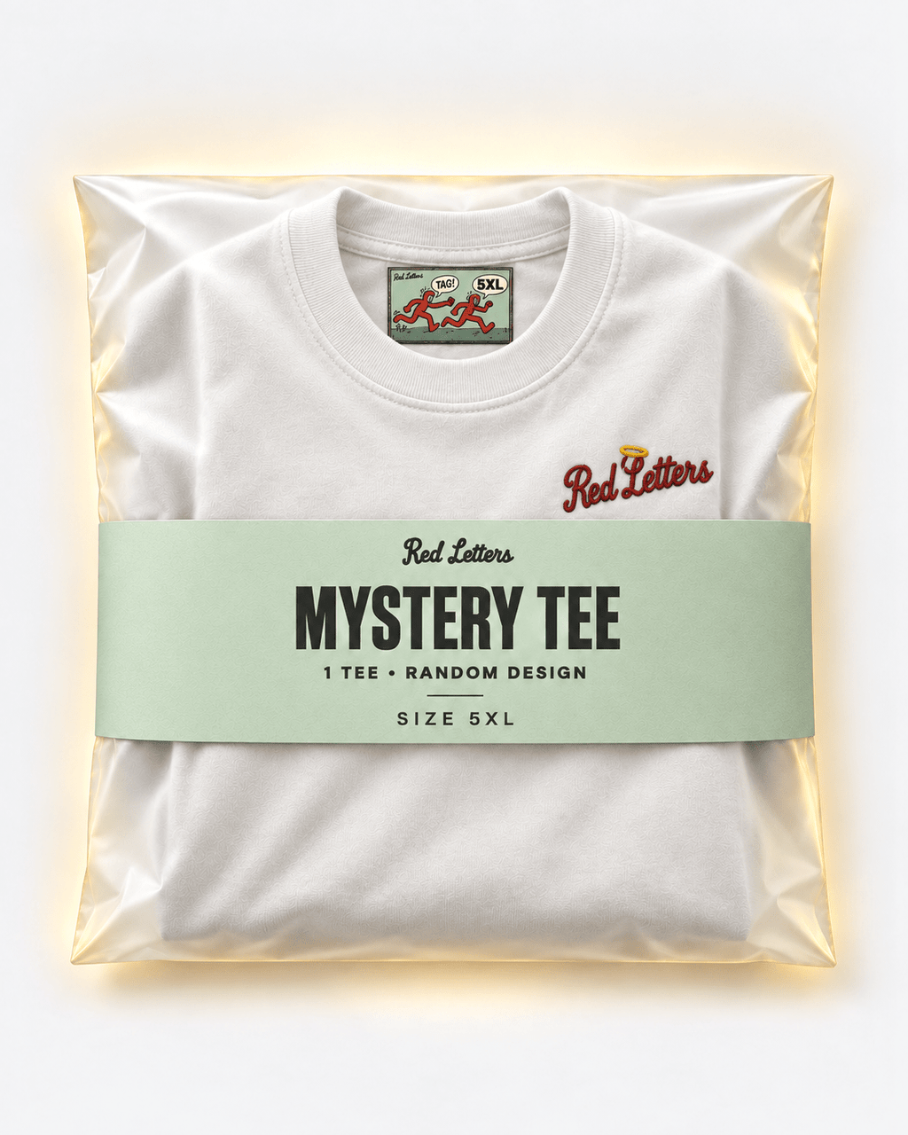 Red Letters Mystery Tee, size 5XL, with a stitched illustrated neck tag, subtle embroidered chest logo and seafoam packaging. One tee, random design.