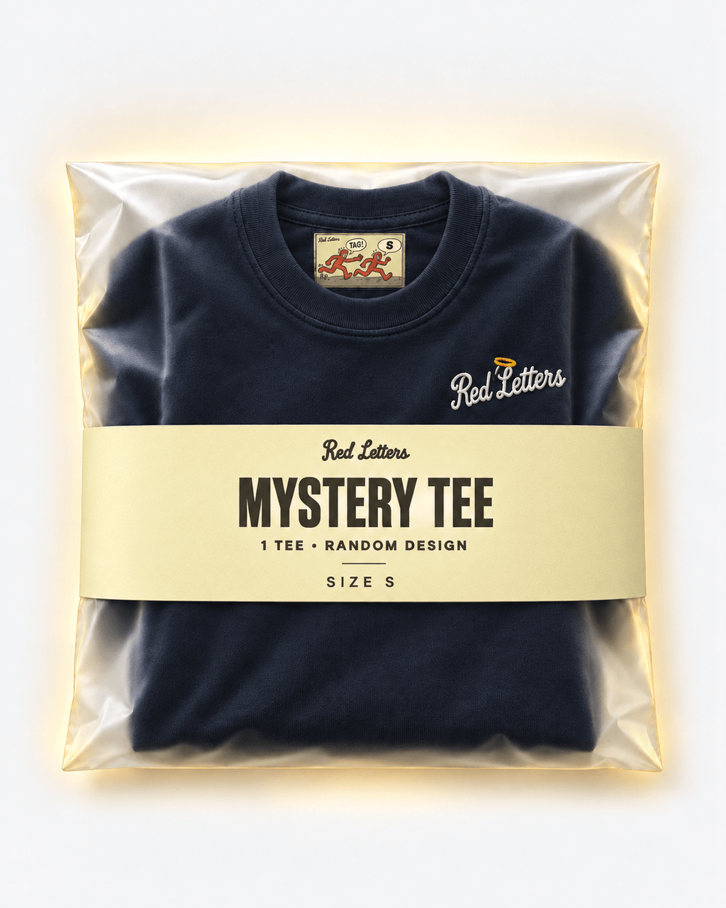 Red Letters Mystery Tee, size S, with a stitched illustrated neck tag, subtle embroidered chest logo and butter packaging. One tee, random design.