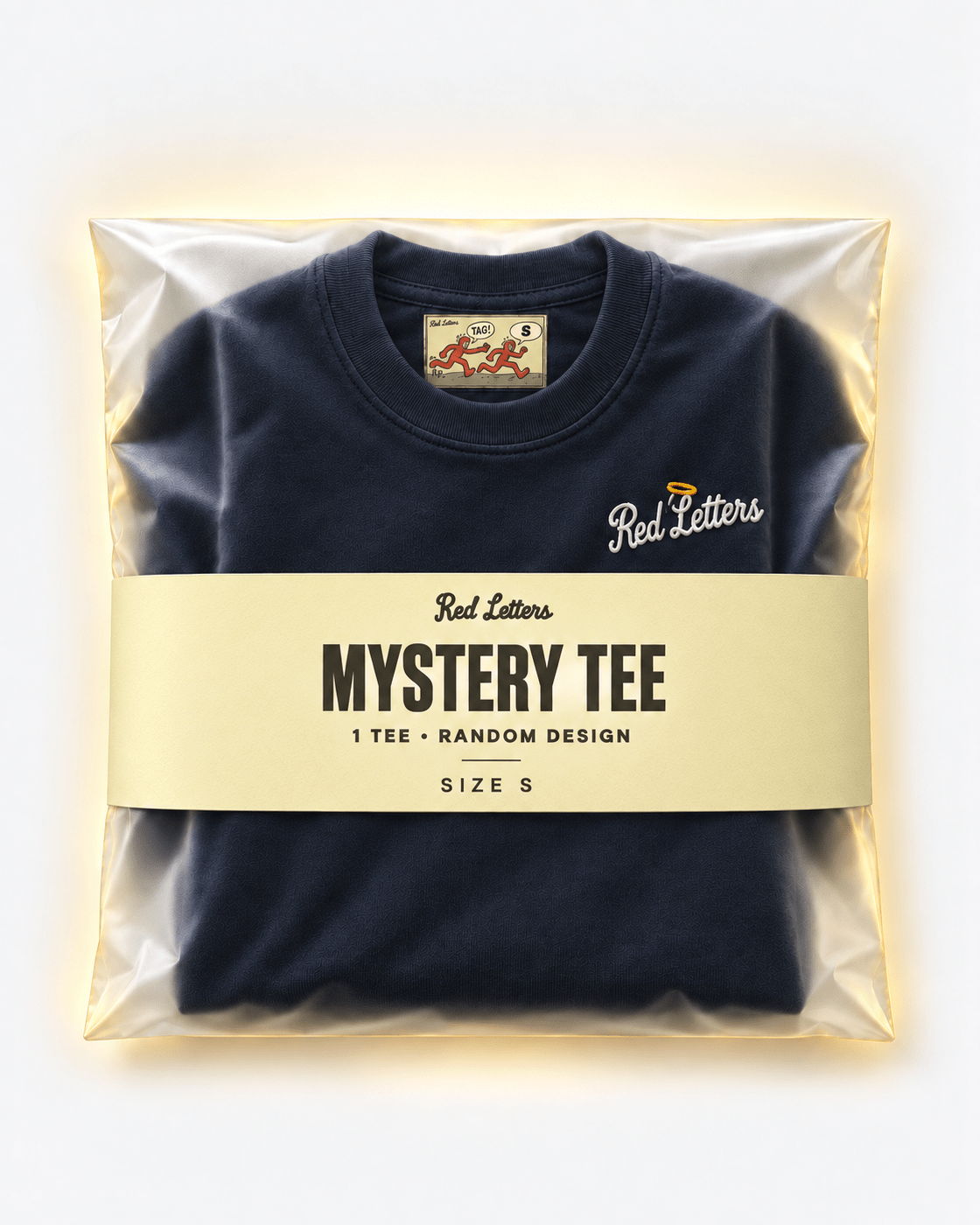 Red Letters Mystery Tee, size S, with a stitched illustrated neck tag, subtle embroidered chest logo and butter packaging. One tee, random design.