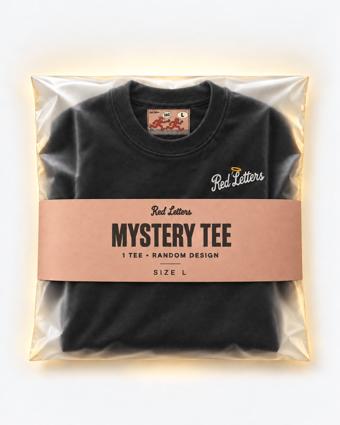 Red Letters Mystery Tee, size L, with a stitched illustrated neck tag, subtle embroidered chest logo and clay packaging. One tee, random design.